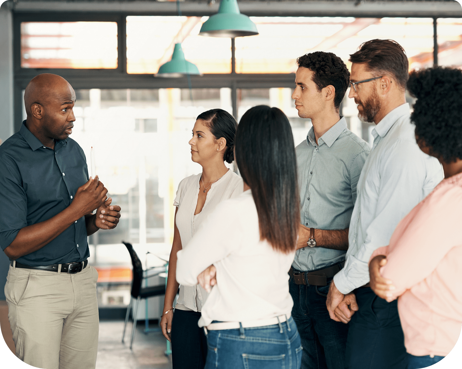 Group meeting with diverse professionals discussing.
